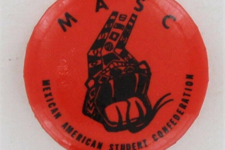 Red button that says "MASC" and "Mexican American Student Confederation" with a snake in the middle. 