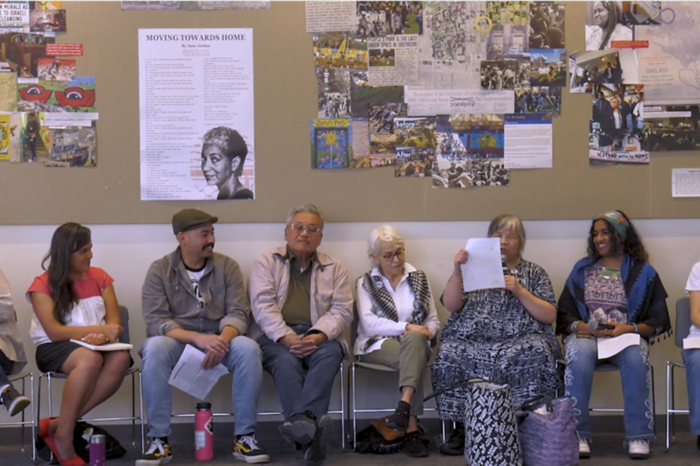 8 people sitting in a panel format with a background featuring June Jordan's poetry